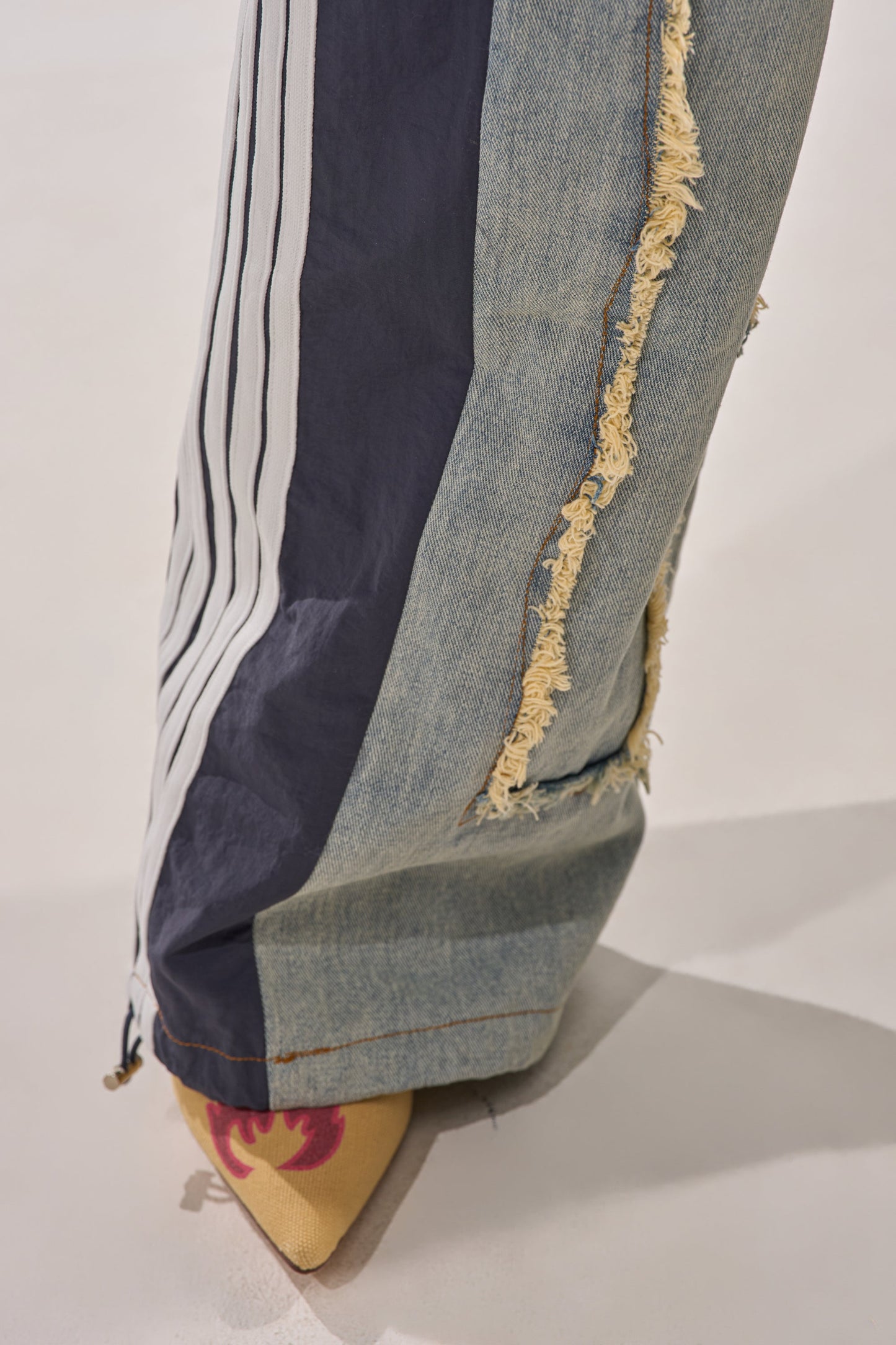 ALL AROUND THE WORLD PATCHWORK DENIM JOGGER PANT IN GREEN MULTI